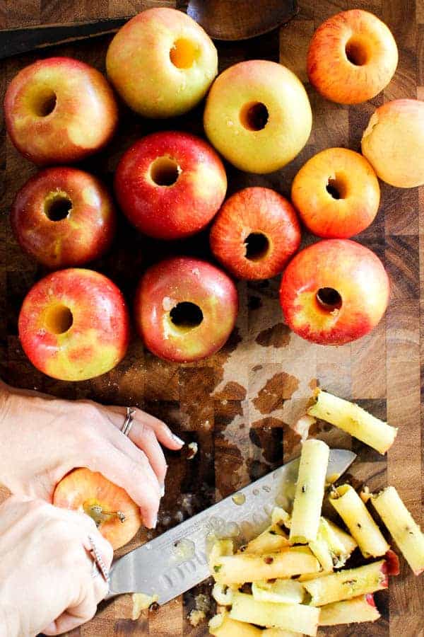 Apples being cored and peeled for making Instant Pot applesauce