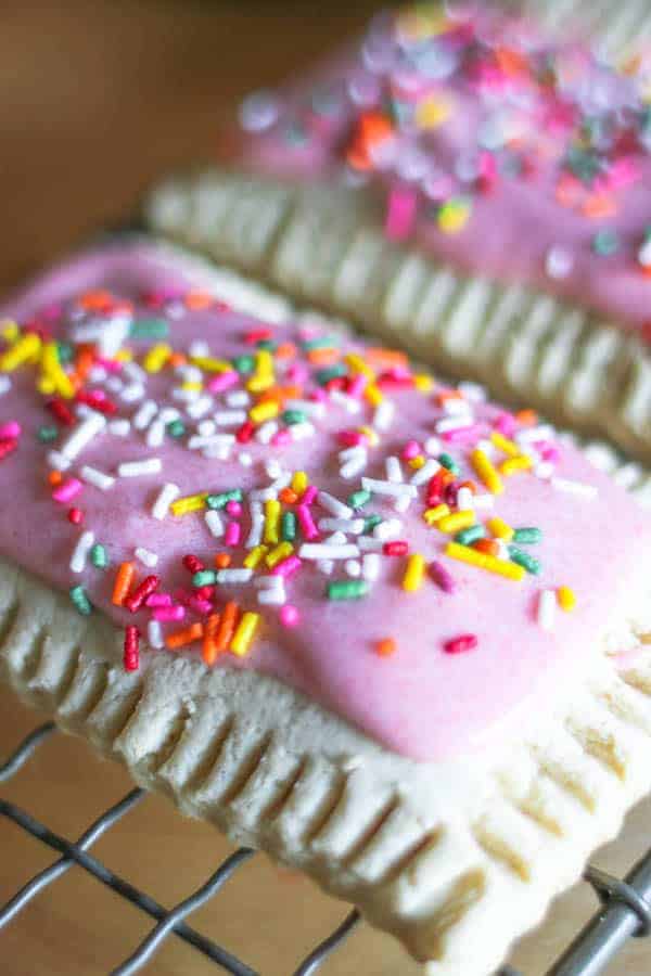 Beautiful pink iced pop tarts topped with colorful sprinkles
