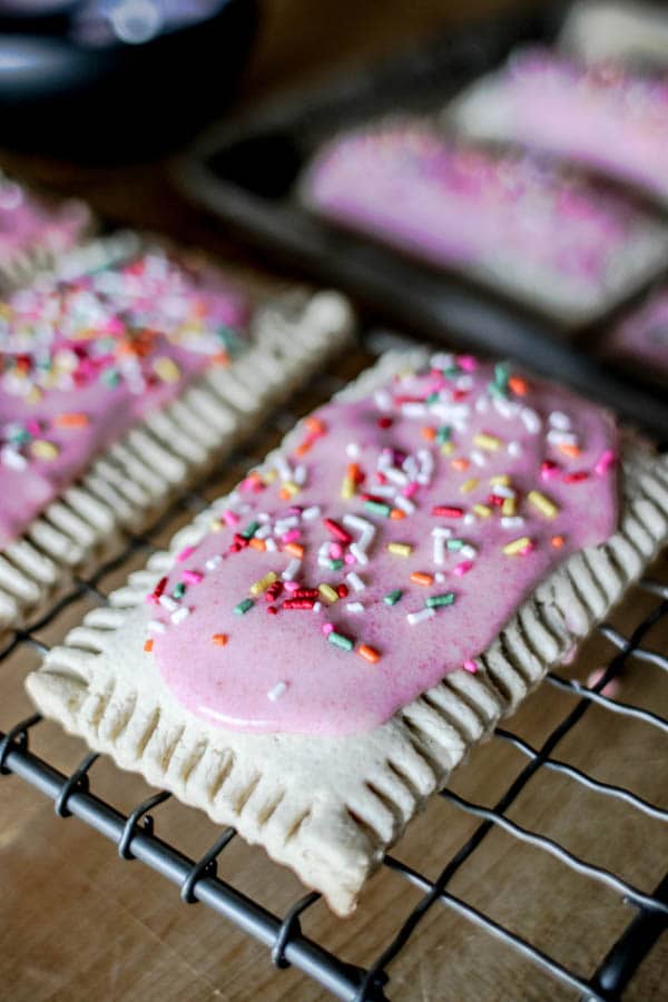 Iced homemade pop tarts on a wire cooling rack