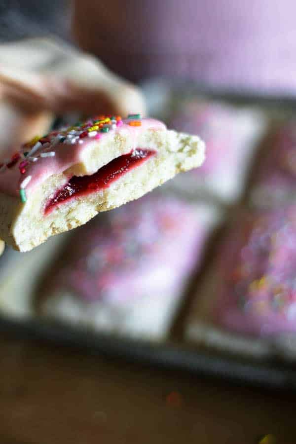 The inside view of homemade pop tarts after it has been broken open to show the jam