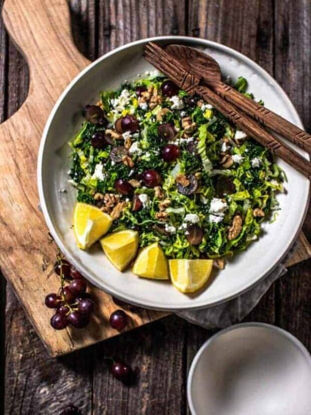 A bowl of Kale Salad with Red Grapes, Walnuts, and Feta
