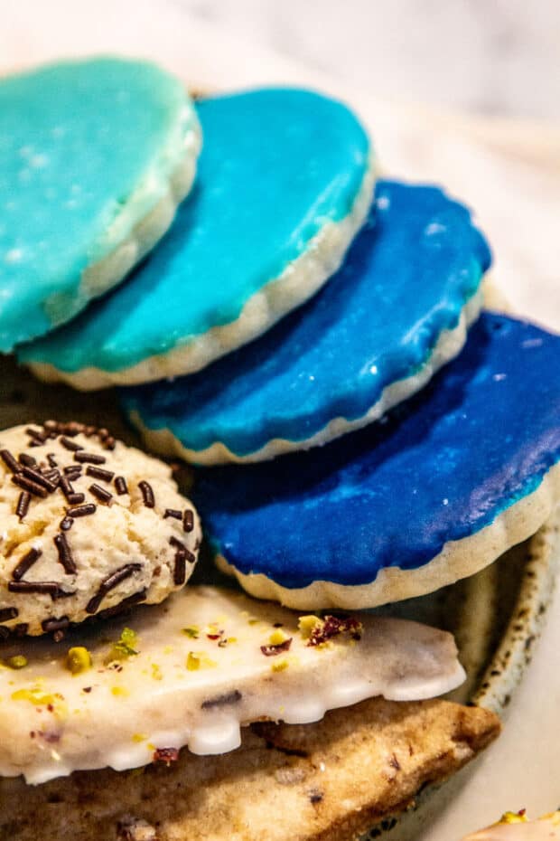 Gluten Free Sugar Cookie Recipe  iced in blue on a cookie plate