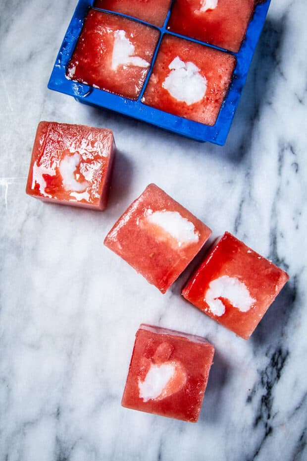 Frozen Watermelon & Coconut Oil Dog Treats recipe  on a marble slab