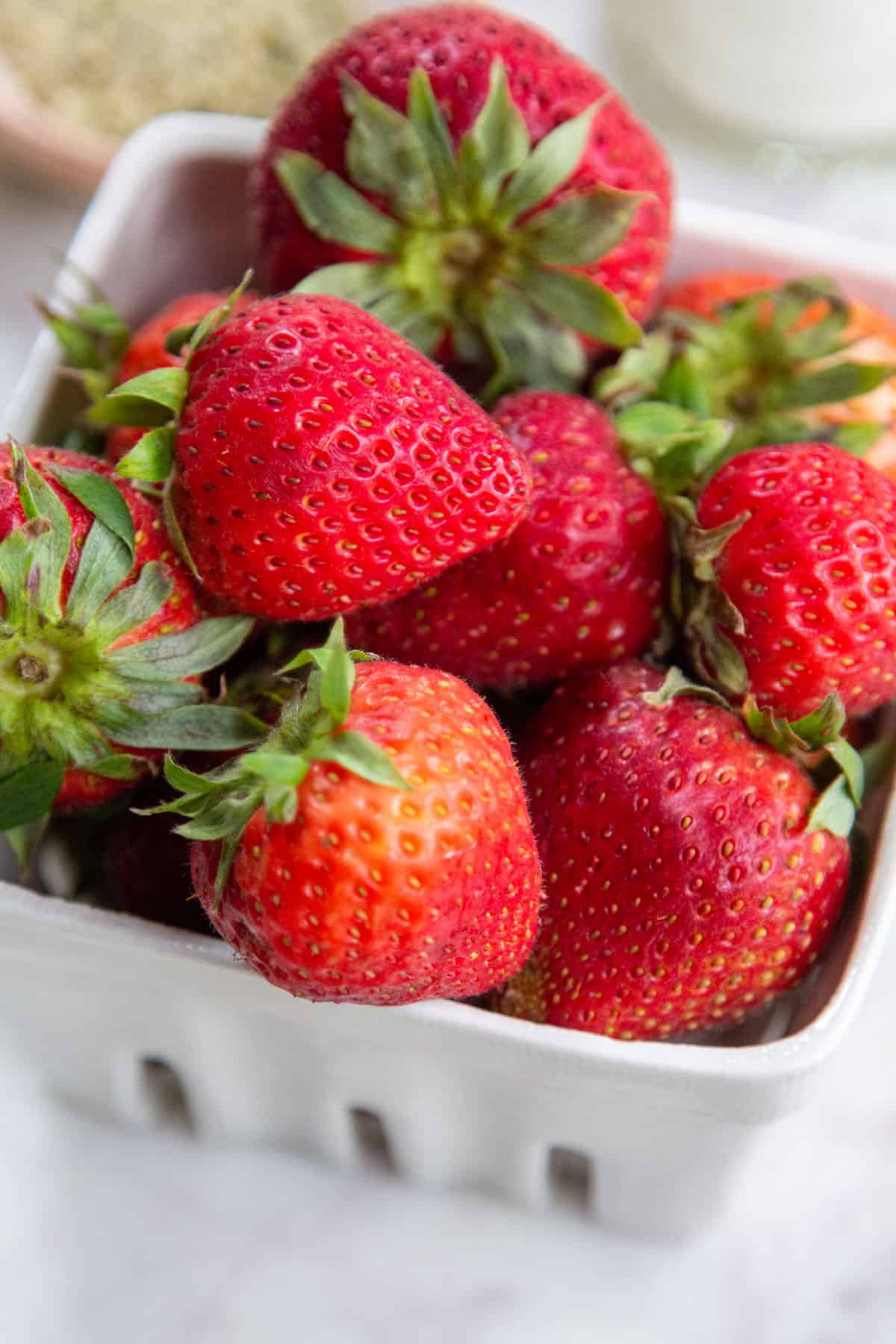 strawberries in awhite basket.