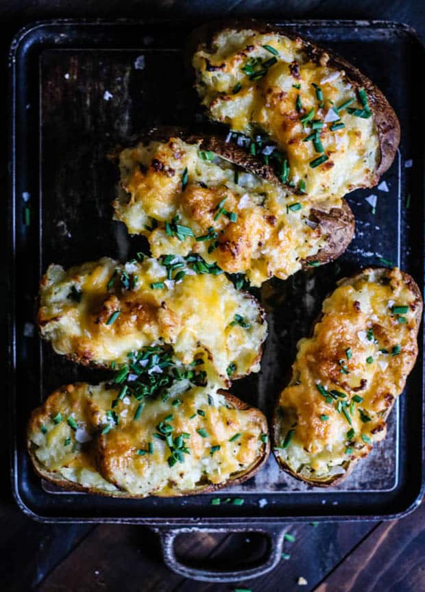 5 twice baked potatoes on black background