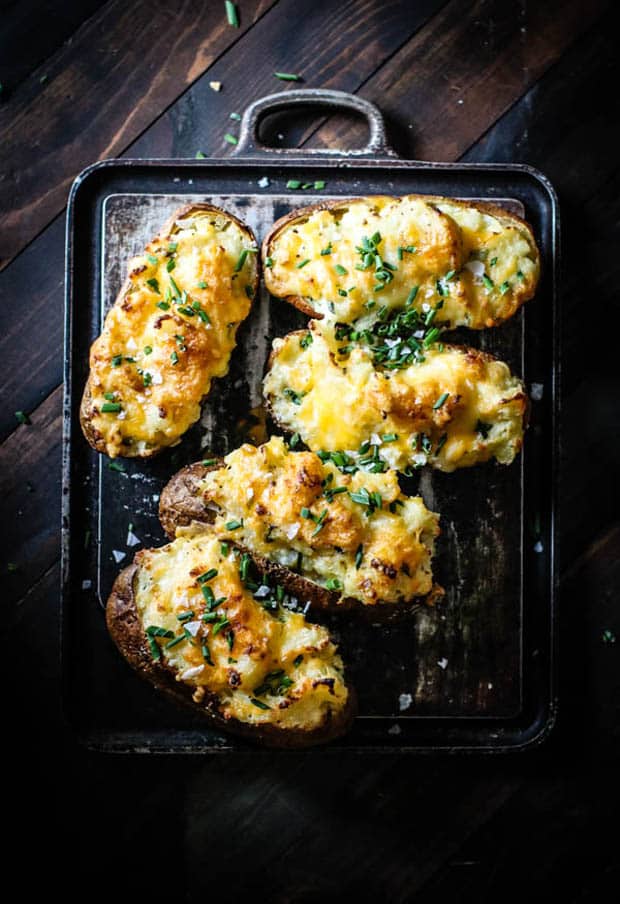 5 twice baked potatoes on black background