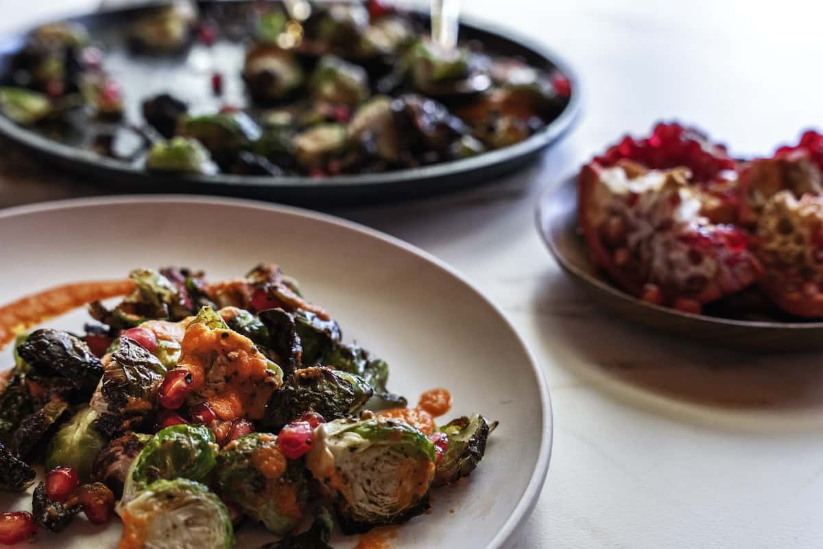 brussels sprouts with red pepper sauce and pomegranate