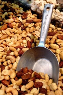 bin of nuts with large metal scoop in it