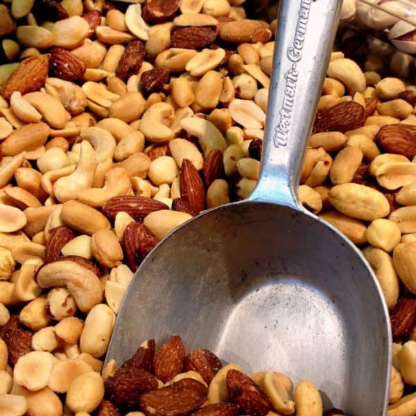 bin of nuts with large metal scoop in it
