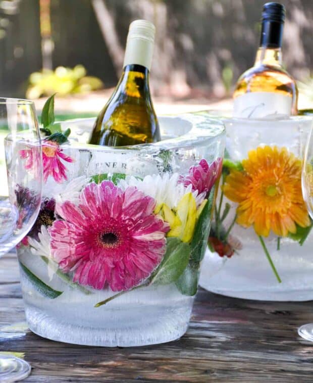 floral ice buckets with wine bottles in them