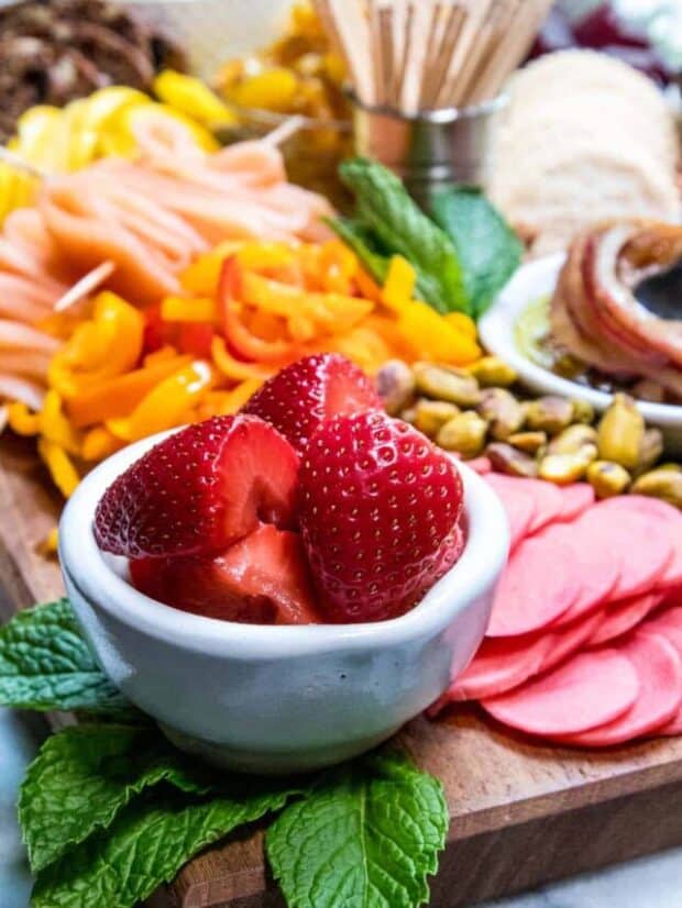 Campari pickled strawberries on a pickle platter.