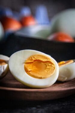 cut open hard boiled egg on plate