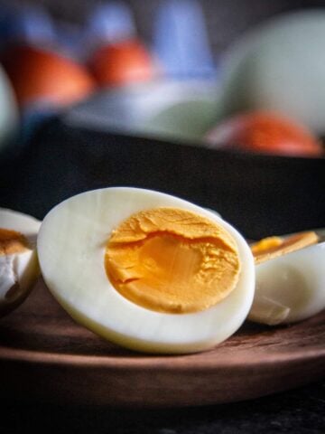 cut open hard boiled egg on plate