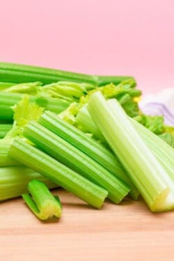 chopped celery sticks on cutting board