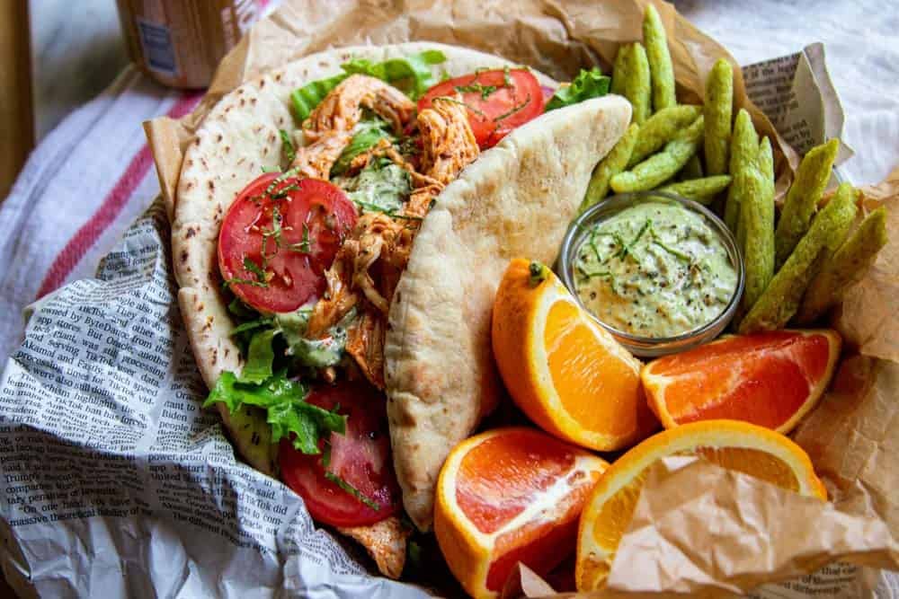 beautiful marinated greek chicken gyro on glass plate